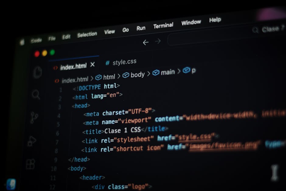 Close-up of a laptop computer screen displaying lines of programming code in a text editor, with a white background and multicolored syntax highlighting for code elements, situated on a desk with dim 